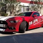 Hope Global Commercial Vehicle Wrap on red Ford Mustang